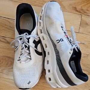 On Running White and Black Athletic Shoes